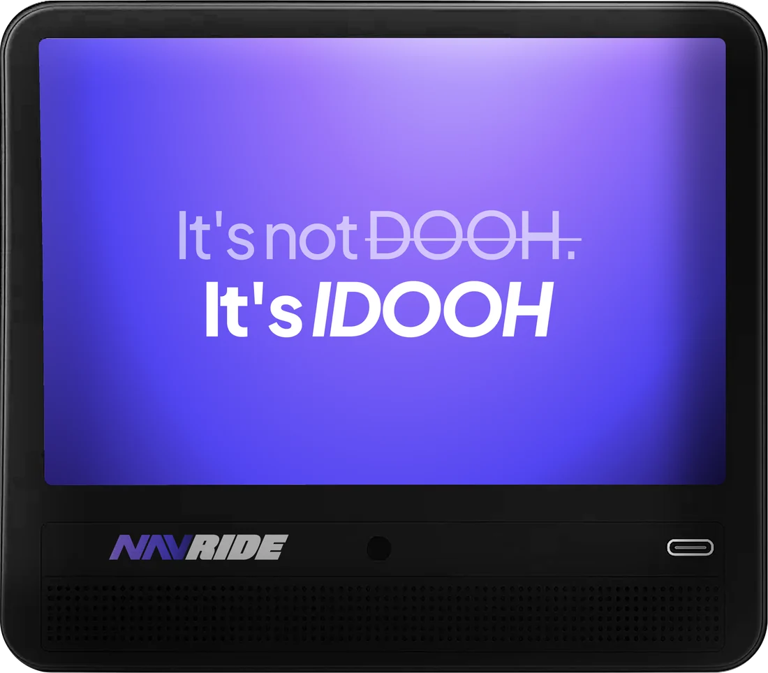 A 10.1-inch NavRide tablet in the headrest of a rideshare car: Main Video playing on the left, the category menu below it, and a Side Banner on the right.